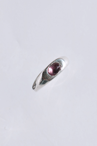 Odissea Aurelia ring in polished sterling silver with a smooth domed band and a single cabochon tourmaline stone.