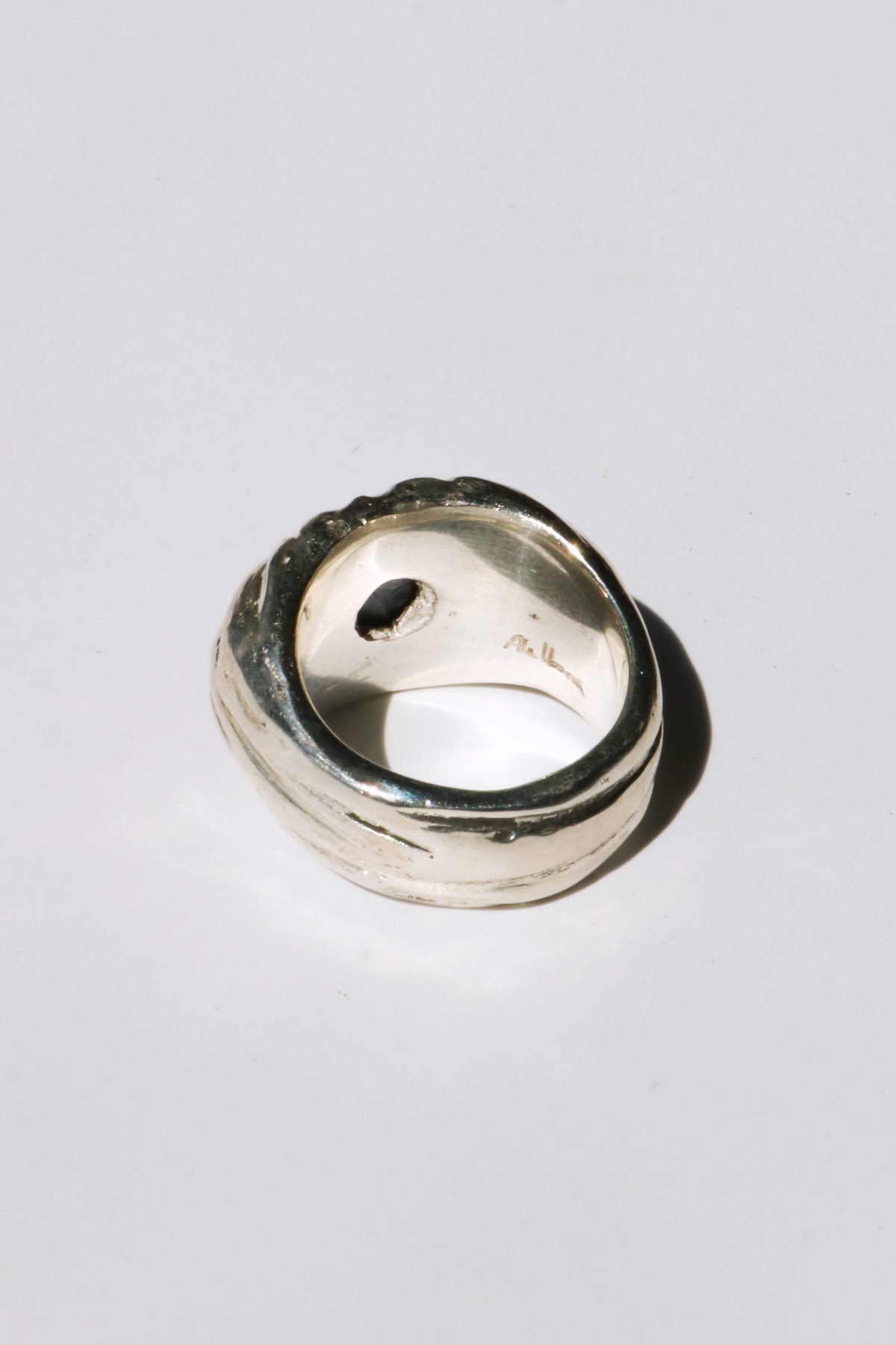 Odissea Dean ring featuring a chunky sculptural silver band with an embedded blue star sapphire gemstone