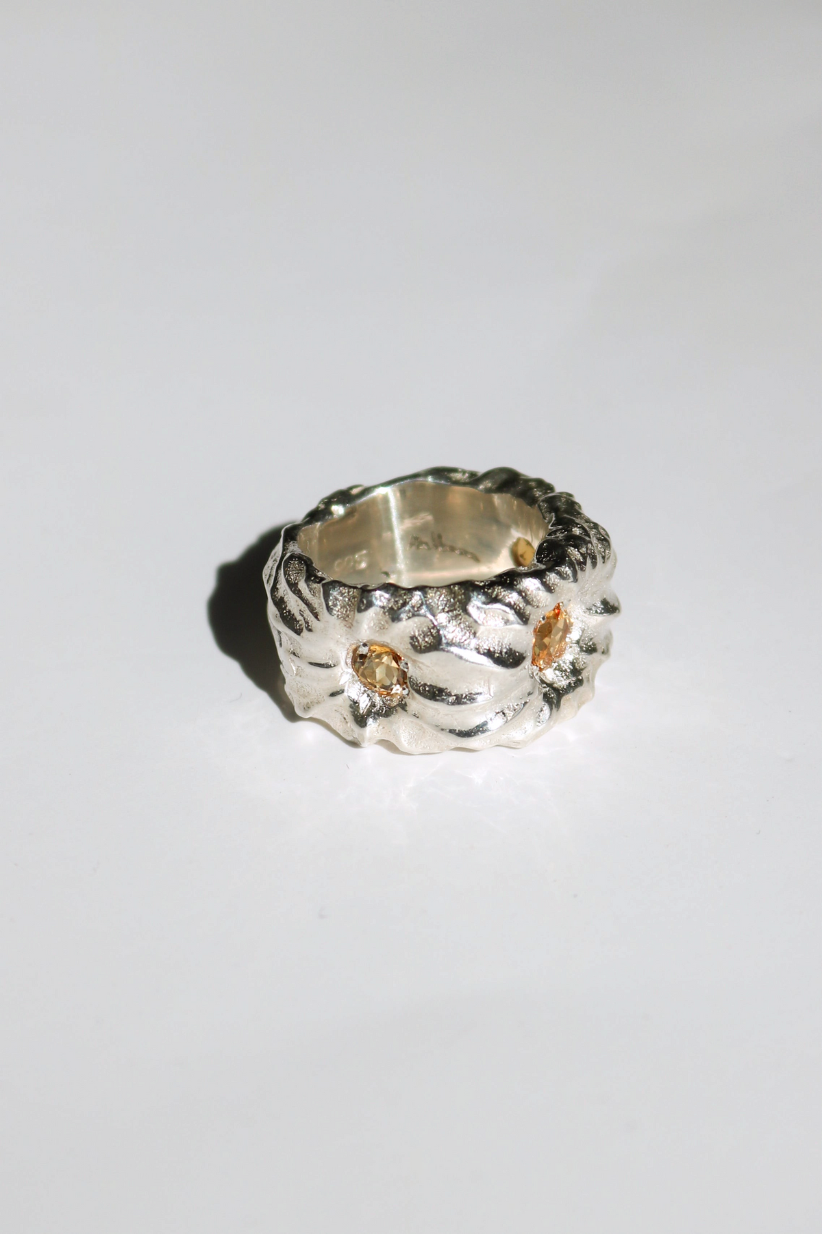 Odissea Willow Ring featuring a chunky, sculptural silver band with embedded citrine stones on a white background.