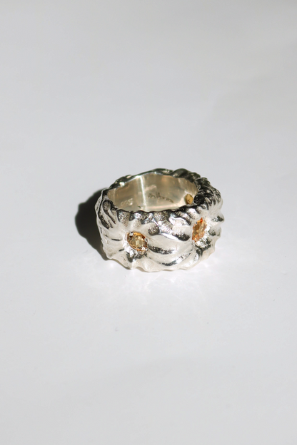 Odissea Willow Ring featuring a chunky, sculptural silver band with embedded citrine stones on a white background.