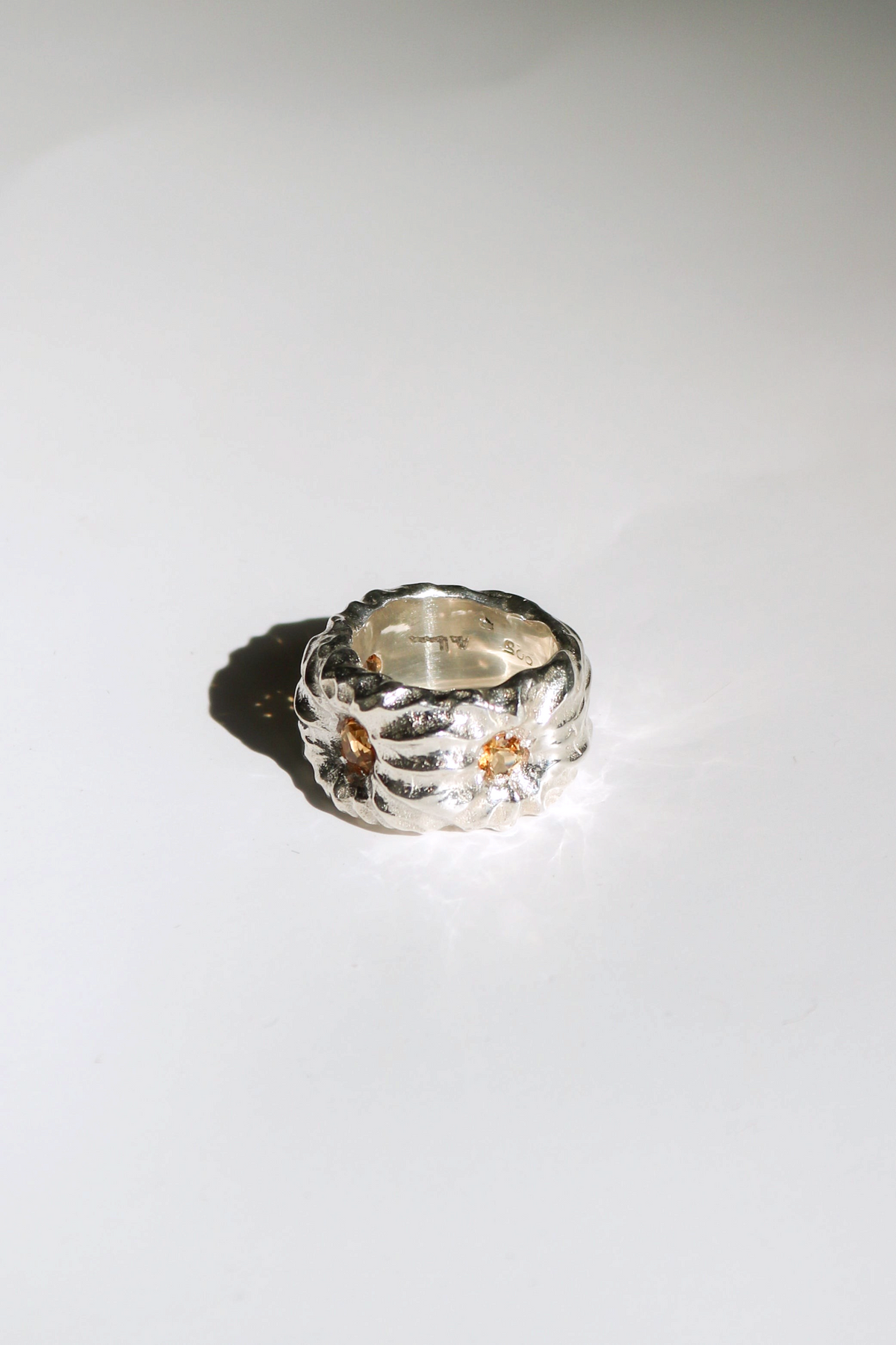Odissea Willow Ring featuring a chunky, sculptural silver band with embedded citrine stones.